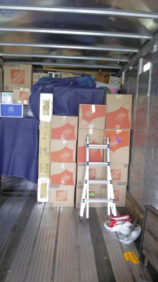 Verlys Pro Moving truck loaded with boxes and wrapped furniture